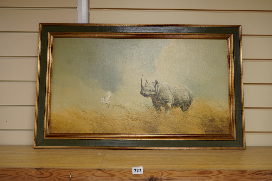 Craig Bone (b.1955), Study of a rhino and bird, signed and dated '87, oil on canvas board, 38 x 70cm